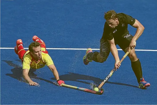  ?? PHOTO: GETTY IMAGES ?? Black Sticks striker Nick Wilson, right, here playing at the 2016 Rio Olympics against Spain, is yet to decide on his hockey future.