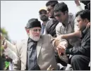  ?? B.K. BANGASH/ THE ASSOCIATED PRESS ?? Supporters of anti-government cleric Tahir-ul-Qadri listen to their leader Saturday in Islamabad, Pakistan. Qadri wants Prime Minister Nawaz Sharif to step down over alleged election fraud.