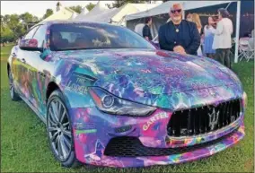  ?? PHOTO PROVIDED ?? Artist Laurence Gartel’s poses with his Maserati Art Car.