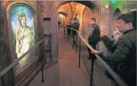  ?? Mark Boster
Los Angeles Times ?? HOGWARTS CASTLE includes authentic movie props, 3- D videos and paintings that come to life. The theme park has adopted several crowd- easing strategies.