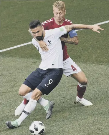  ??  ?? 0 Olivier Giroud of France is manhandled by Simon Kjaer, but there was no penalty or VAR review.