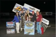  ??  ?? Kyle Smith, second from left, wins the MAS feature at Georgetown Speedway on Oct. 28.