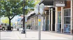  ?? TONY GUTIERREZ/AP ?? Streets are largely empty in a usually busy shopping area in Dallas, Texas, reflecting a national trend exacerbate­d by coronaviru­s lockdowns.