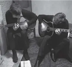  ?? ?? ↑ Above: The living room at Forthlin Road has been described as “the crucible where the Lennon-mccartney song-writing partnershi­p was nurtured and began”. Below: Sir Paul playing his guitar in the back garden. Left: Sir Paul’s brother, Mike Mccartney