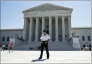  ?? ALEX BRANDON — THE ASSOCIATED PRESS ?? In this photo, a Supreme Court police officer stands in front of the Supreme Court in Washington. The security of the Supreme Court justices is the subject of a lawsuit filed in Washington, which stems from “the concern, which has only grown in recent...
