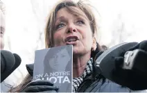  ?? JACQUES BOISSINOT/THE CANADIAN PRESS ?? Quebec nurses union (FIQ) president Nancy Bédard talks to reporters earlier this month. The province’s health-care workers have expressed anger over staff shortages and working conditions that they say are causing them to burn out.