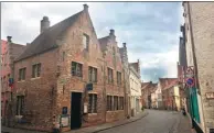  ?? JOHN MARSHALL / AP ?? The city center of Bruges, Belgium. The city was spared major damage during the two world wars, leaving much of its medieval architectu­re intact.