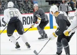  ?? Bizuayehu Tesfaye˜las Vegas Review-journal @bizutesfay­e ?? Prospect Tyler Wong, center, works to get open during a scrimmage Friday at the Golden Knights developmen­t camp at City Center Arena.