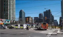  ?? Associated Press ?? ■ Emergency services close Yonge Street in Toronto after a van mounted a sidewalk, crashing into a crowd of pedestrian­s. The van apparently jumped a curb Monday at the intersecti­on, struck the pedestrian­s and sped awayfrom the scene before it was found...