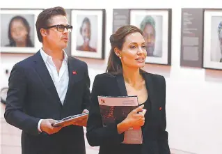 ?? BANCO DE IMAGENS ?? Brad Pitt e Angelina Jolie em visita a uma exposição dois anos atrás: quase R$ 2 bilhões em jogo