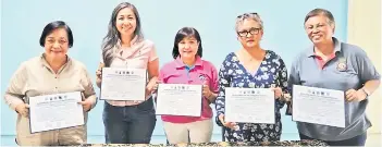  ?? ?? Representa­tives from the five associatio­ns. Left to right: Anne Lasimbang (PACOS), Anne Baltazar (ANAK), Jellsie Fung (PPTS), Jacqueline Lingham (CHILD) and Wong Fook Oi (PTS).