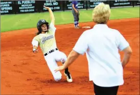  ?? LARRY GREESON / For the Calhoun Times ?? Calhoun’s Ashlyn Barnes (left) slides into third base as head coach Diane Smith instructs her to get down during Thursday’s game.