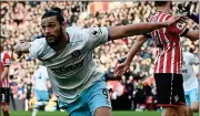  ??  ?? FLYING HIGH: Andy Carroll celebrates scoring the equaliser