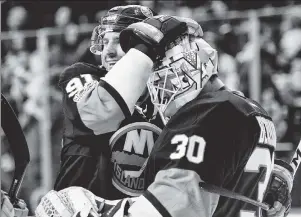  ?? Corey Sipkin ?? HAPPY DAYS: Captain John Tavares (left) celebrates with goalie Jean-Francois Berube after the Islanders beat the Kings, 4-2, on Saturday.