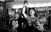  ?? VINCENT THIAN/AP ?? Pro-democracy candidate Jimmy Sham, right, celebrates Monday after his election win in Hong Kong.