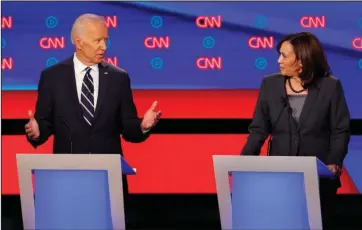  ?? The Associated Press ?? PRIMARY DEBATE: In this July 31, 2019, file photo, former Vice President Joe Biden speaks as Sen. Kamala Harris, D-Calif., listens during the second of two Democratic presidenti­al primary debates hosted by CNN in the Fox Theatre in Detroit. As presumptiv­e Democratic presidenti­al nominee Joe Biden begins the process of choosing a running mate amid the coronaviru­s crisis, managing the pandemic has become its own version of an audition. For potential picks, lobbying for the job means breaking into the national conversati­on, positionin­g themselves as leaders and executing at their day job.