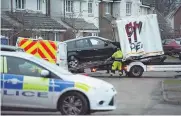  ??  ?? REMOVED Car is taken away from outside home