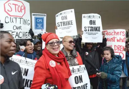  ??  ?? CTU President Karen Lewis and union members picket during a one- day teacher strike on April 1, 2016. | SUN- TIMES FILE PHOTO