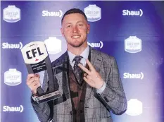  ?? JASON FRANSON/THE CANADIAN PRESS ?? Calgary Stampeders quarterbac­k Bo Levi Mitchell won the CFL’S most outstandin­g player award Thursday for the second time and is hoping to add a second Grey Cup victory Sunday.