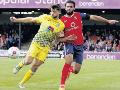  ?? Www.mphotograp­hic.co.uk ?? Jason Oswell goes shoulder to shoulder with York’s Hamza Bencherif