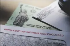  ?? AP PHOTO/ERIC GAY, FILE ?? President Donald Trump’s name is seen on a stimulus check issued by the IRS to help combat the adverse economic effects of the COVID-19 outbreak, in 2020 in San Antonio.