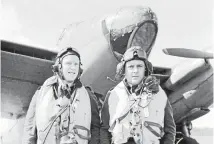  ??  ?? Remarkable career: Wing Commander Reginald Reynolds, right, with his navigator, Flight Lieutenant E B Sismore, and a de Havilland Mosquito.