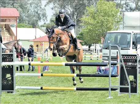  ?? Thrilling action: ?? Brad Hearn goes over a jump at the 2019 Benalla Spring Show.