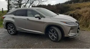  ??  ?? HOT OFF THE PRESS: The very competent Lexus RX450h after delivering piles of newspapers to the ASH animal charity in deepest Wicklow. Right: cabin decked out in rich cream leather