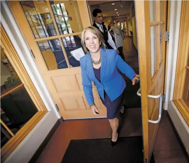  ??  ?? RIGHT: Lujan Grisham leaves The New Mexican office after an interview Oct. 8.