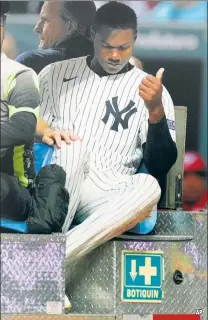  ?? ?? THAT’S GOTTA HURT: Oscar Gonzalez is driven off the field in Mexico City after taking a foul ball off his face, fracturing his right orbital.