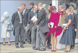  ??  ?? Duchess of Cambridge, 2nd right, in raspberry Alexander McQueen dress and Philip Treacy hat, with royal guests at Princess Eugenie and Jack Brooksbank’s Windsor Castle wedding