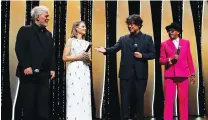  ?? (Gonzalo Fuentes/Reuters) ?? THE OPENING CEREMONY of the 74th Cannes Film Festival with, from left, Pedro Almodovar, Jodie Foster, Bong Joon-ho and Spike