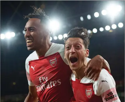  ??  ?? Pierre-Emerick Aubameyang celebrates with Mesut Ozil after scoring against Leicester 3 4 5