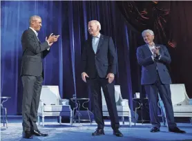  ?? ?? The rare showing of three Democratic presidents presented a united front to help Biden bring together a Democratic coalition that’s shown signs of splinterin­g.