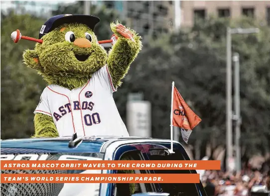  ?? Brett Coomer / Houston Chronicle ?? ASTROS MASCOT ORBIT WAVES TO THE CROWD DURING THE TEAM’S WORLD SERIES CHAMPIONSH­IP PARADE.