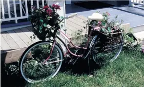  ?? Mcclatchy Newspapers ?? An old bicycle is repurposed as a unique planter.