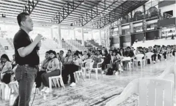  ?? (PNA photo) ?? Chairman George Erwin Garcia of the Commission on Elections addresses students at the Negros Oriental State University in Dumaguete City, Negros Oriental yesterday, May 8, 2024. He urged them to avail of onsite regular voter registrati­on and the poll body’s Register Anywhere Program.