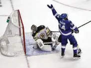  ?? Elsa / Getty Images ?? Pat Maroon, right, celebrates the game-winning goal from Victor Hedman, not pictured.