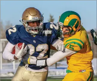  ?? Herald photo by Cam Yoos ?? John Evans of the LCI Rams wraps up Javier Williams of the Calgary Notre Dame Pride during teh Alberta Schools Athletic Associatio­n Tier I Regional semifinals Saturday afternoon at the University of Lethbridge Stadium.