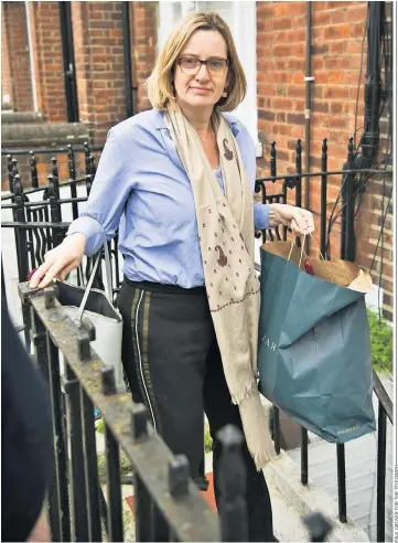  ??  ?? Amber Rudd returns home yesterday. Her resignatio­n over the deportatio­n target scandal was accepted by Theresa May last night