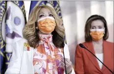  ?? AP photo ?? Rep. Lucy McBath, D-Ga. (left), whose son was a victim of gun violence, joins Speaker of the House Nancy Pelosi, D-Calif., at a news conference on passage of gun violence prevention legislatio­n, at the Capitol on Thursday.