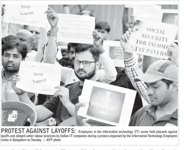 ??  ?? PROTEST AGAINST LAYOFFS:
Employees in the informatio­n technology (IT) sector hold placards against layoffs and alleged unfair labour practices by Indian IT companies during a protest organised by the Informatio­n Technology Employees Union in Bangalore...