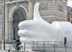  ?? GETTY IMAGES ?? ▪ Hitting ‘Like’: A gigantic sculpture in Milan, Italy