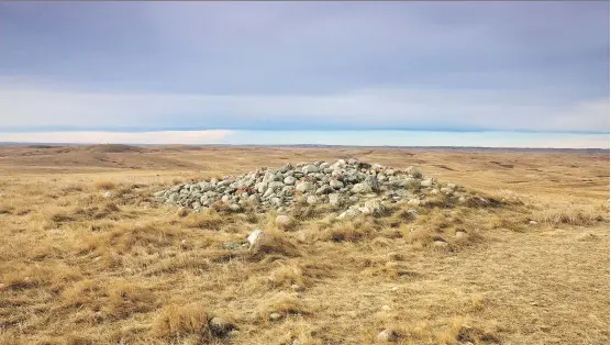  ?? PHOTOS: ANDREW PENNER ?? The first stones of the centre cairn at the Majorville Medicine Wheel were laid approximat­ely 5,000 years ago, making it 1,000 years older than Stonehenge.