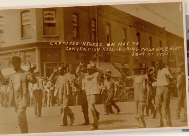  ??  ?? ABOVE-LEFT
Captured African American residents of Greenwood being marched to the Convention Hall