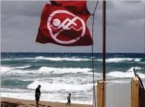  ?? BRUCE R. BENNETT / THE PALM BEACH POST ?? On Saturday, the National Weather Service called for a moderate risk of rip currents in Atlantic Ocean waters. Forecaster­s on Sunday talked of chances of a named cyclone and issued tropical storm watches for the central Gulf Coast.