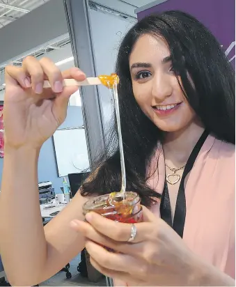  ?? DAN JANISSE ?? Ana Hassanpour displays her all-natural hair removal mixture Wednesday during Pitch Day competitio­n for the 2017 RBC Top Founders Award at the University of Windsor.