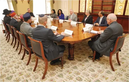  ?? — AFP ?? King Charles hosts an audience with community faith leaders from across the UK, in the Billiard Room at Buckingham Palace in London on Tuesday. The King met community faith leaders who have taken part in a Windsor Leadership Trust programme, encouragin­g and supporting dialogue, harmony and understand­ing at a time of heightened internatio­nal tension.