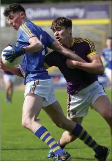  ??  ?? Wicklow’s Padraig O’Toole comes up against Brian Deeney.