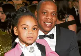  ??  ?? Blue Ivy Carter with dad Jay-z has music flowing in her veins.